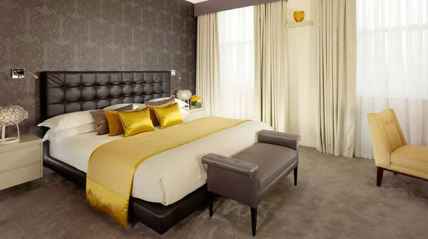 Luxury bedroom at 51 Buckingham Gate, Taj Suites and Residences in London, elegant and cozy.