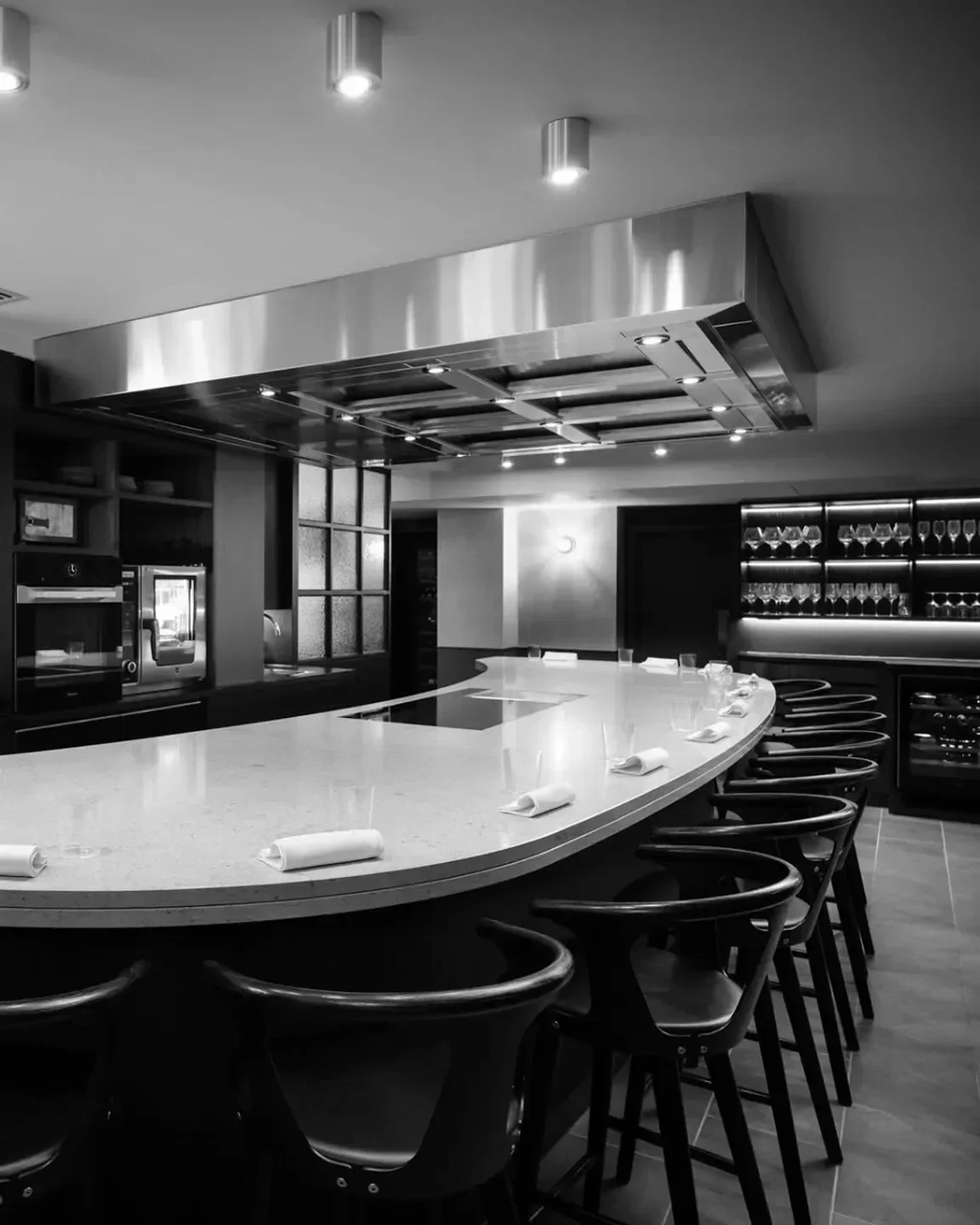 Modern curved bar at Aulis London restaurant, a fine dining experience in London.