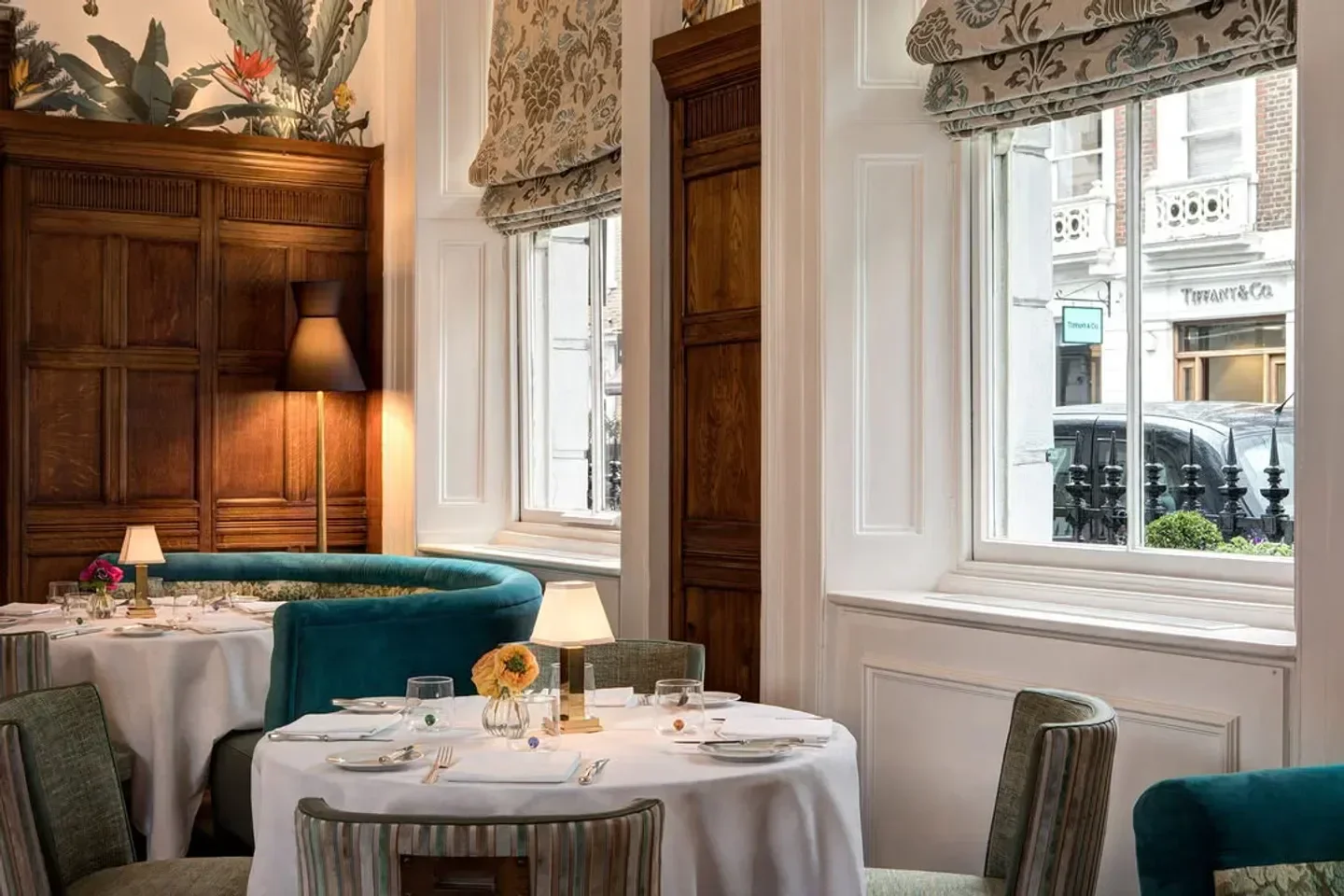 Elegant dining room at Charlie's restaurant in London, with table setting and city view