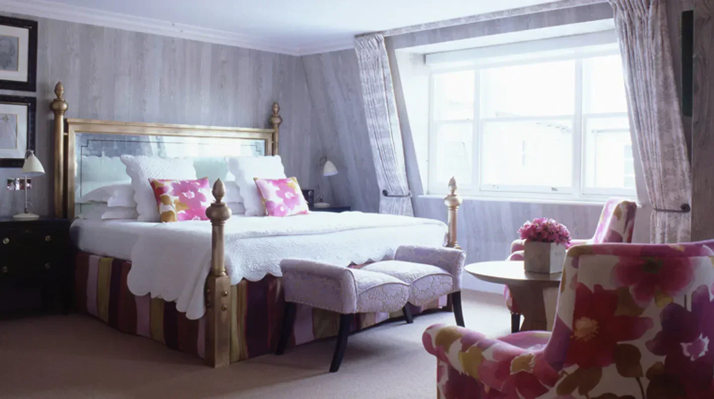 Cozy bedroom at Charlotte Street Hotel in London, with floral accents and stylish decor.
