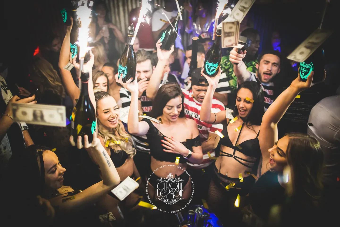 Celebratory atmosphere at Cirque le Soir London, with bottles and confetti flying around.