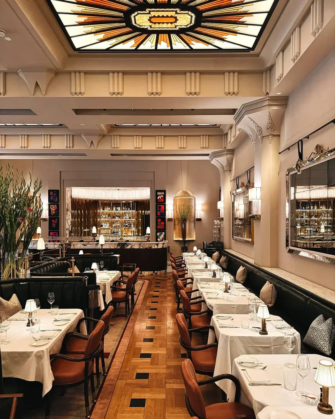 Elegant interior of Claridge's Restaurant in London, with tables set for dining.