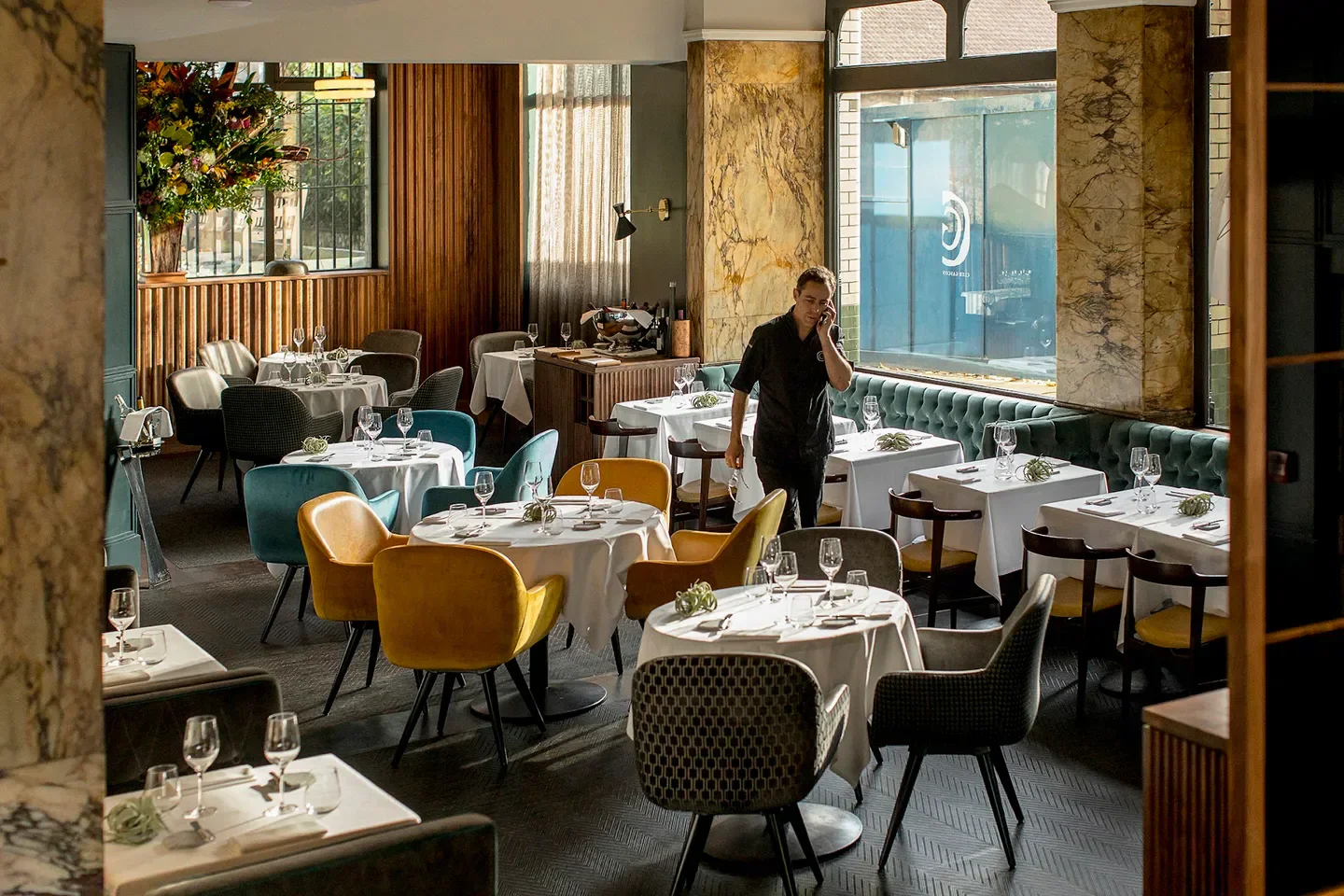 Interior of Club Gascon restaurant in London, featuring stylish seating and tables.