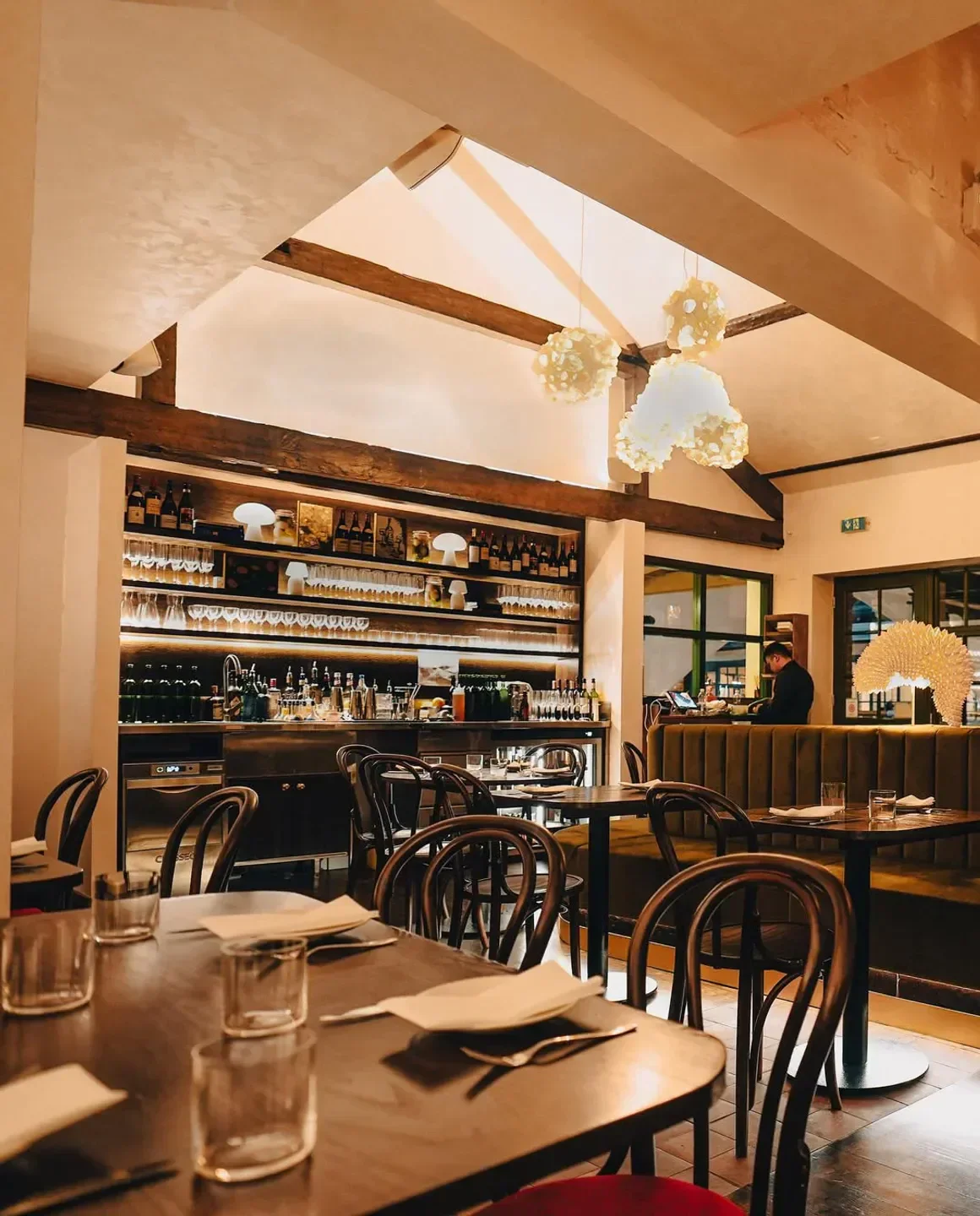 Cozy interior of Donia restaurant in London with elegant dining tables and bar