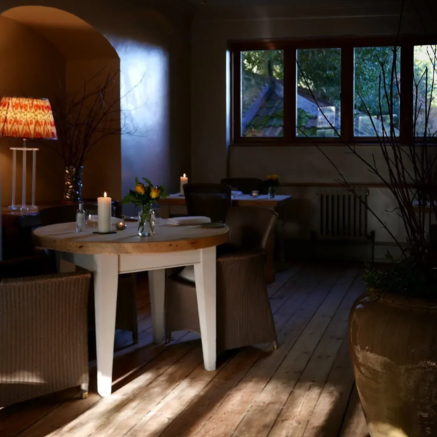 Cozy candlelit dining at Dysart Petersham in London, a restaurant with natural light.