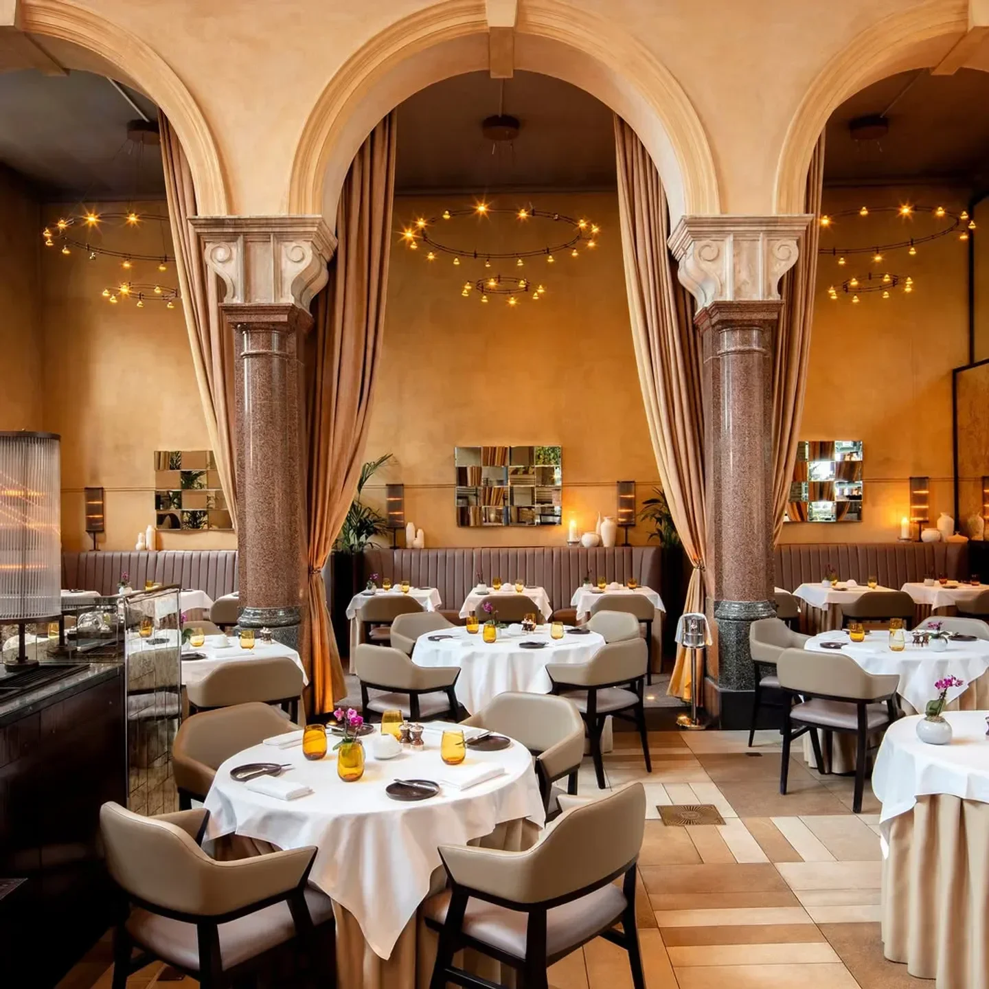 Elegant dining room interior at Galvin Bar & Grill in London, featuring arched architecture.
