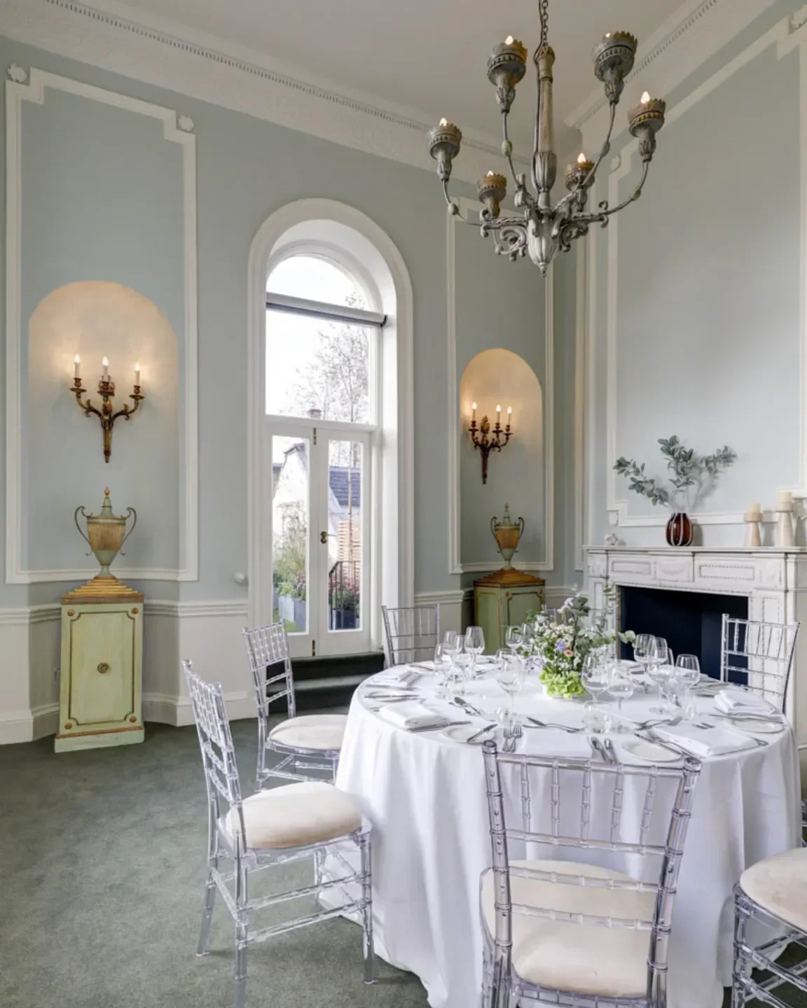 Elegant dining room interior at Helix by Searcys in London, featuring a round table setting.