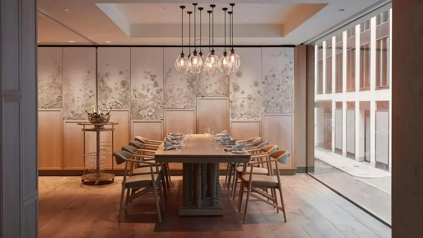Elegant dining room at HIDE restaurant in London with floral wall art and light fixtures