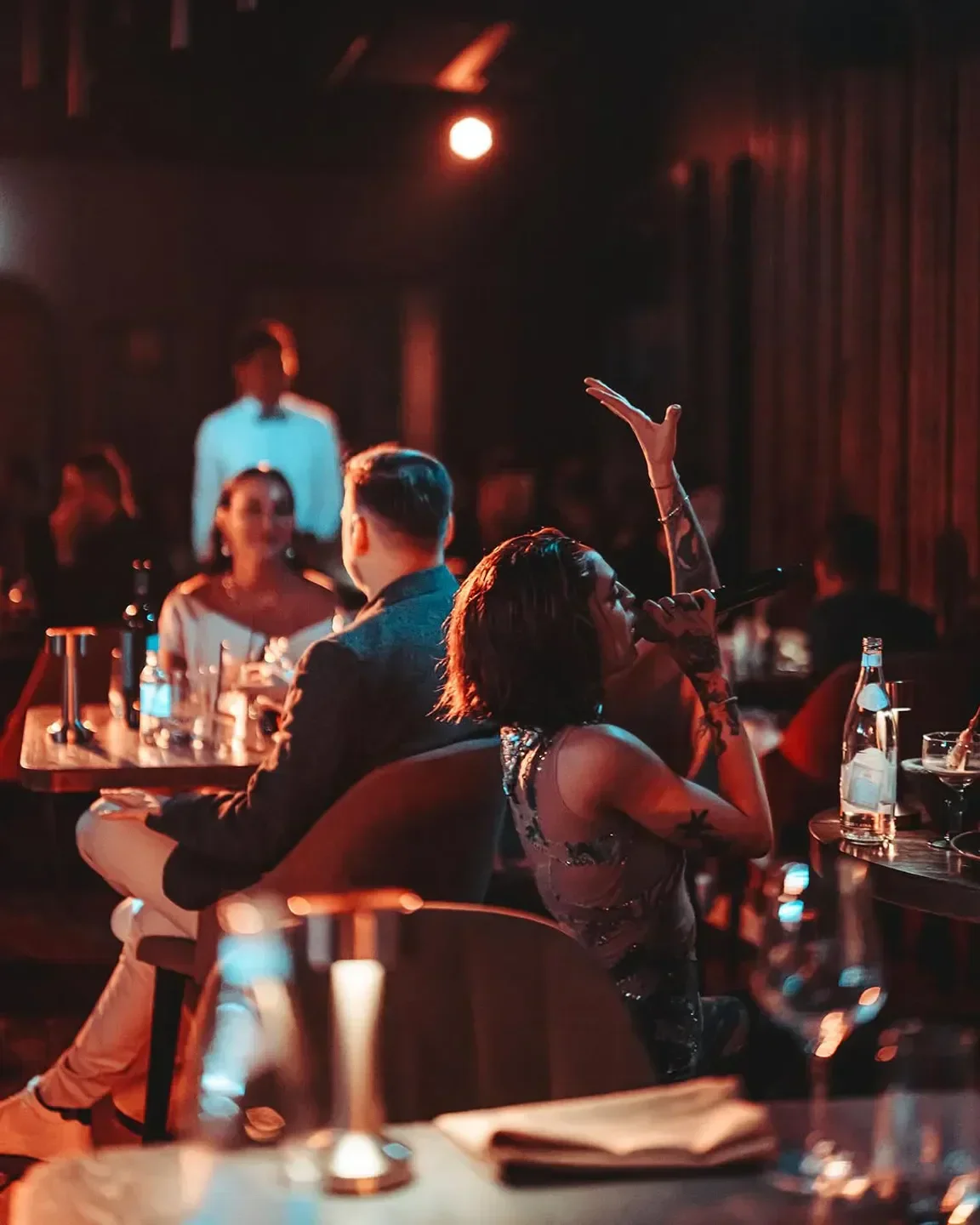 Entertainer performing at Inca restaurant in London, with a dim and sophisticated ambiance.