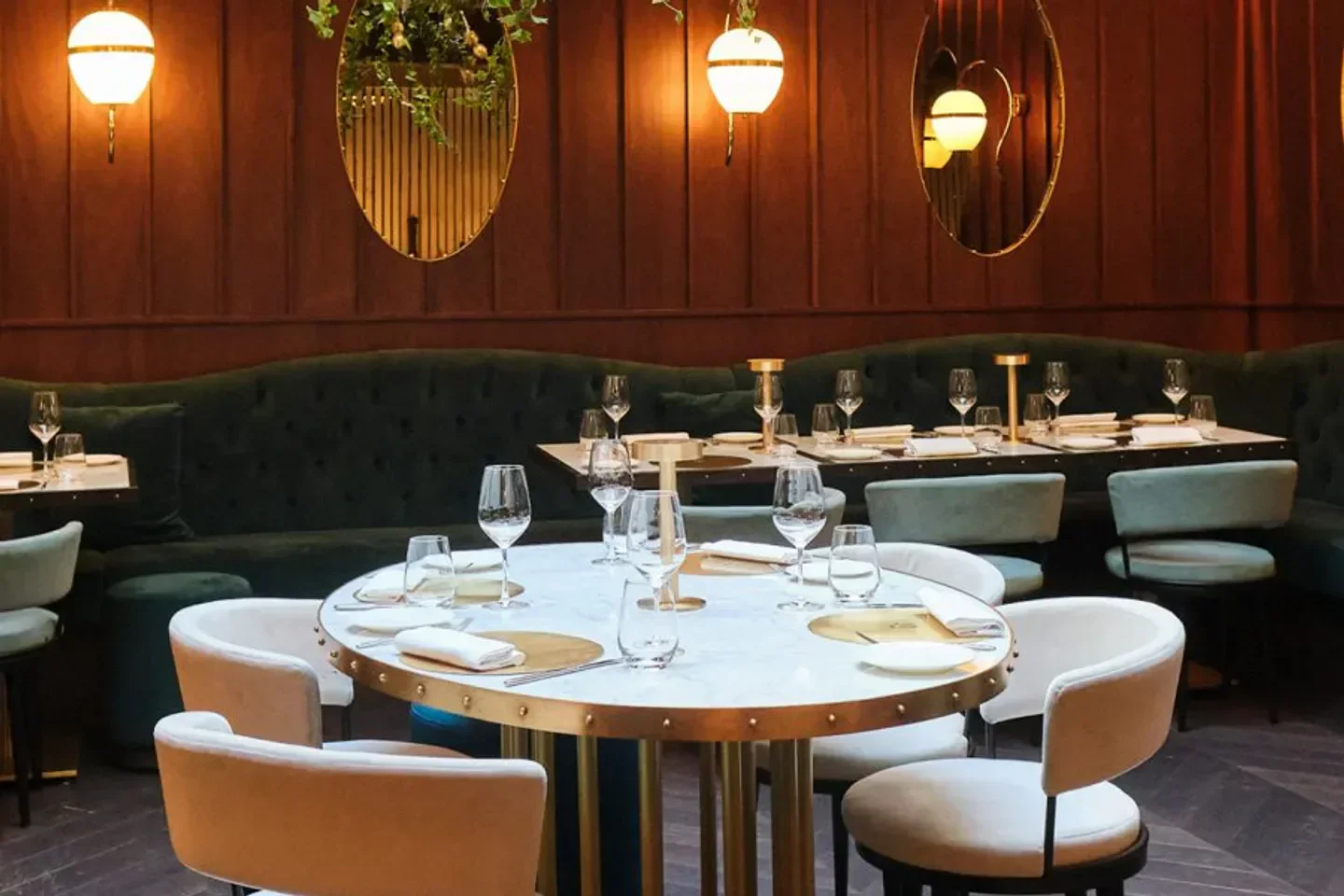 Elegant dining area at IT Restaurant in London with stylish decor and seating.
