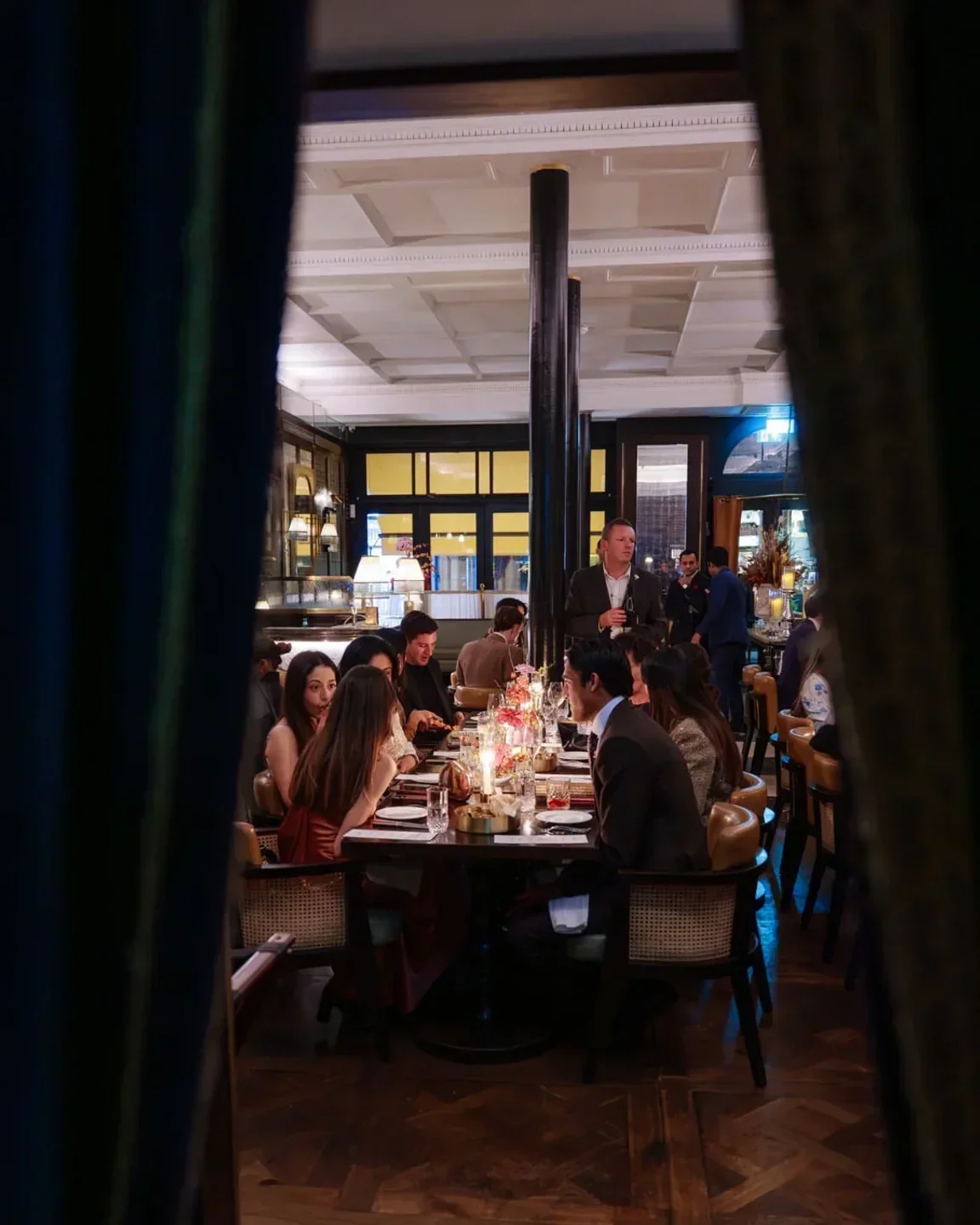 Elegant dining scene at Jamavar London, featuring a group enjoying a meal together.