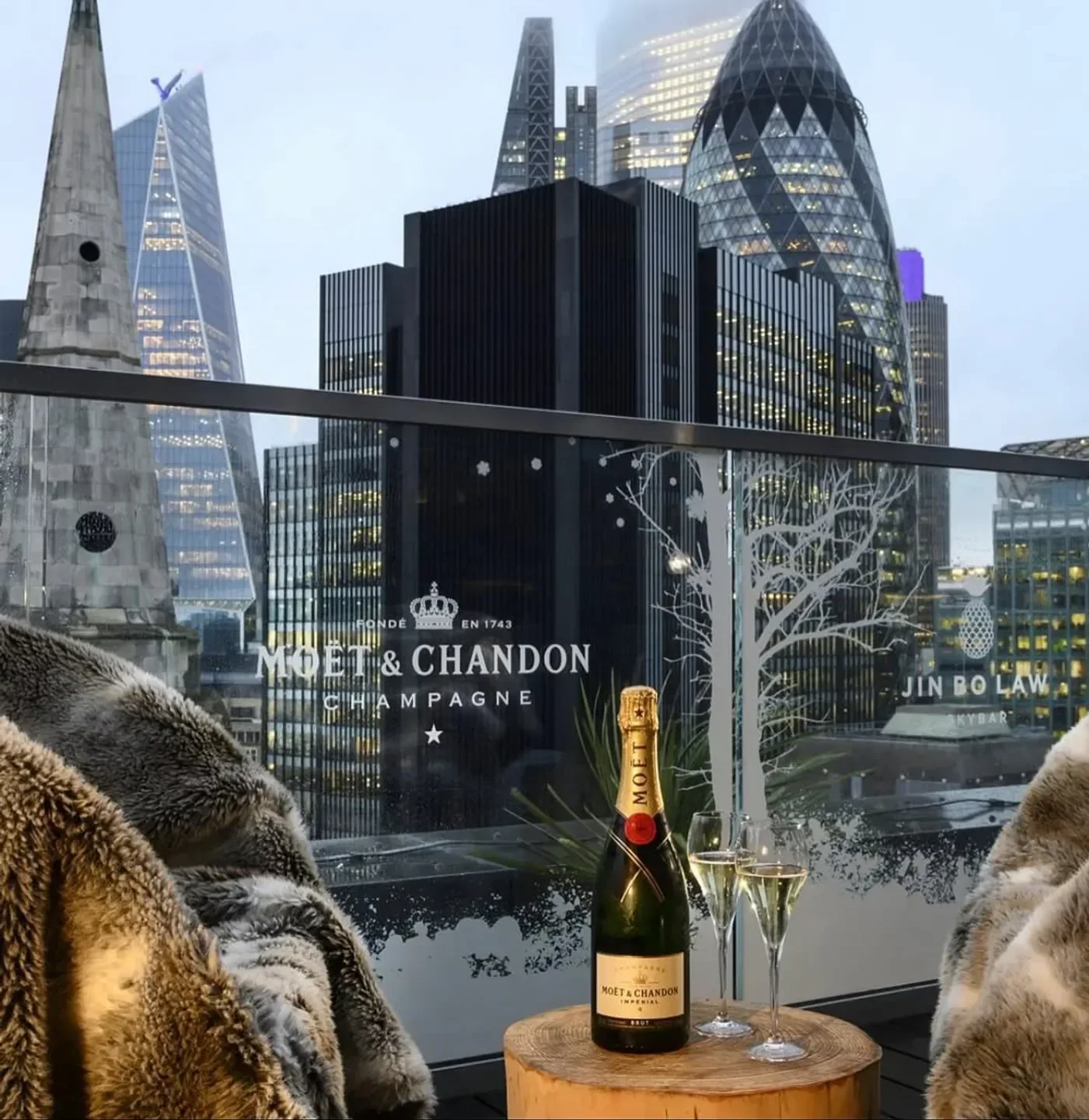 Moët & Chandon at Jin Bo Law Skybar in London, overlooking the city skyline.