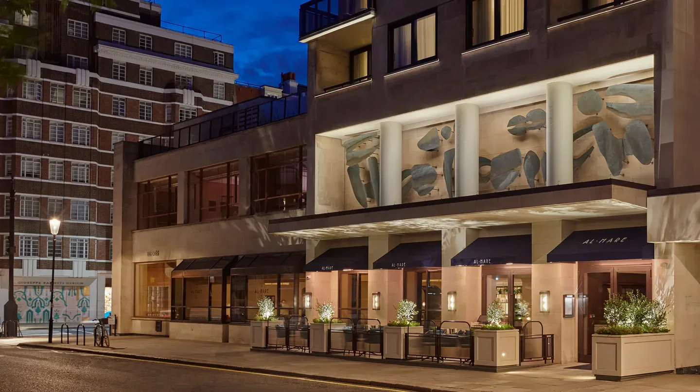 Exterior of Jumeirah Carlton Tower Hotel in London, showcasing elegant architecture at dusk