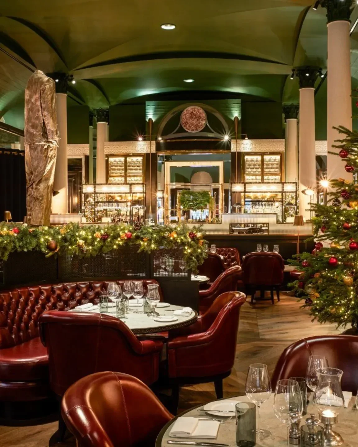 Festive interior of Kerridge's Bar & Grill in London, featuring Christmas decorations and elegant dining