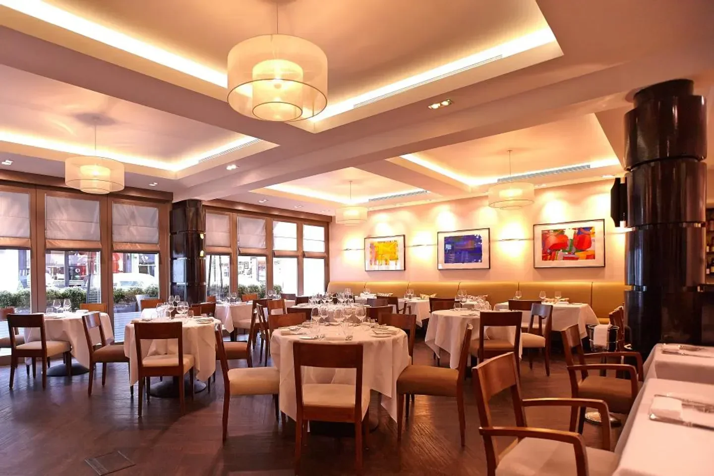 Elegant dining room interior at La Trompette restaurant in London with tables set.
