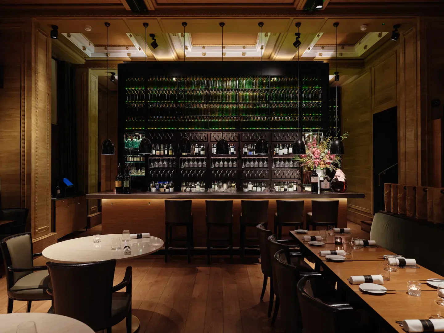 Interior of Les 110 de Taillevent London restaurant with bar and tables, London.