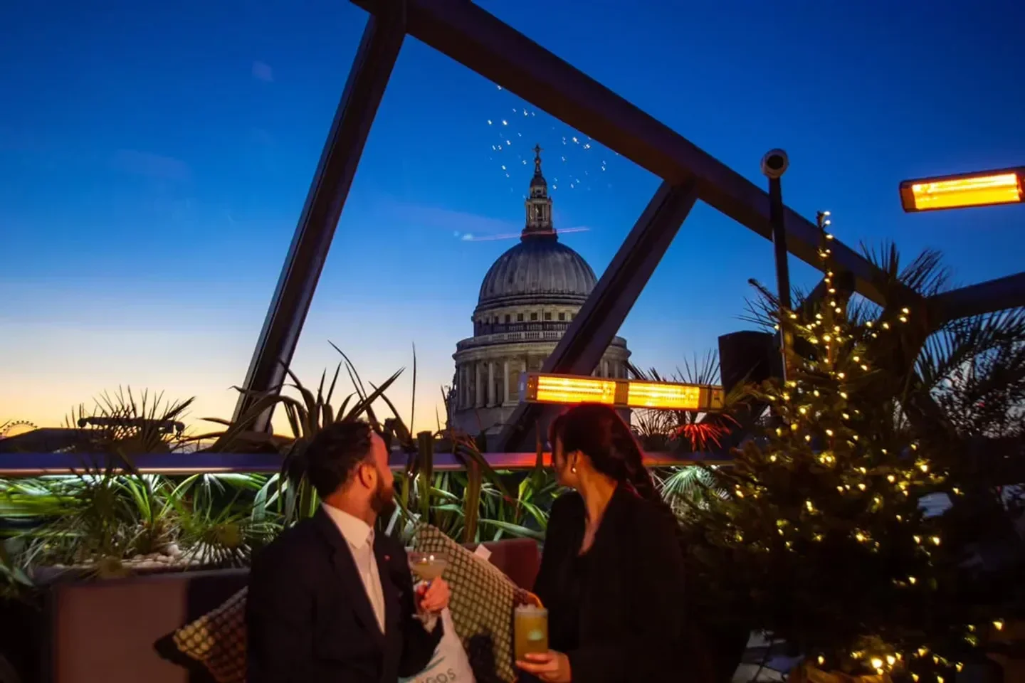 Rooftop view at Madison, London, with St. Paul's Cathedral at sunset.