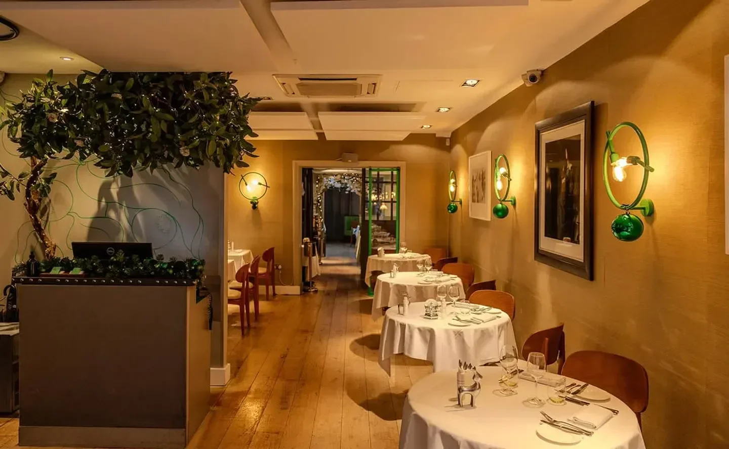 Interior of Medlar restaurant in London with elegant dining tables and decor