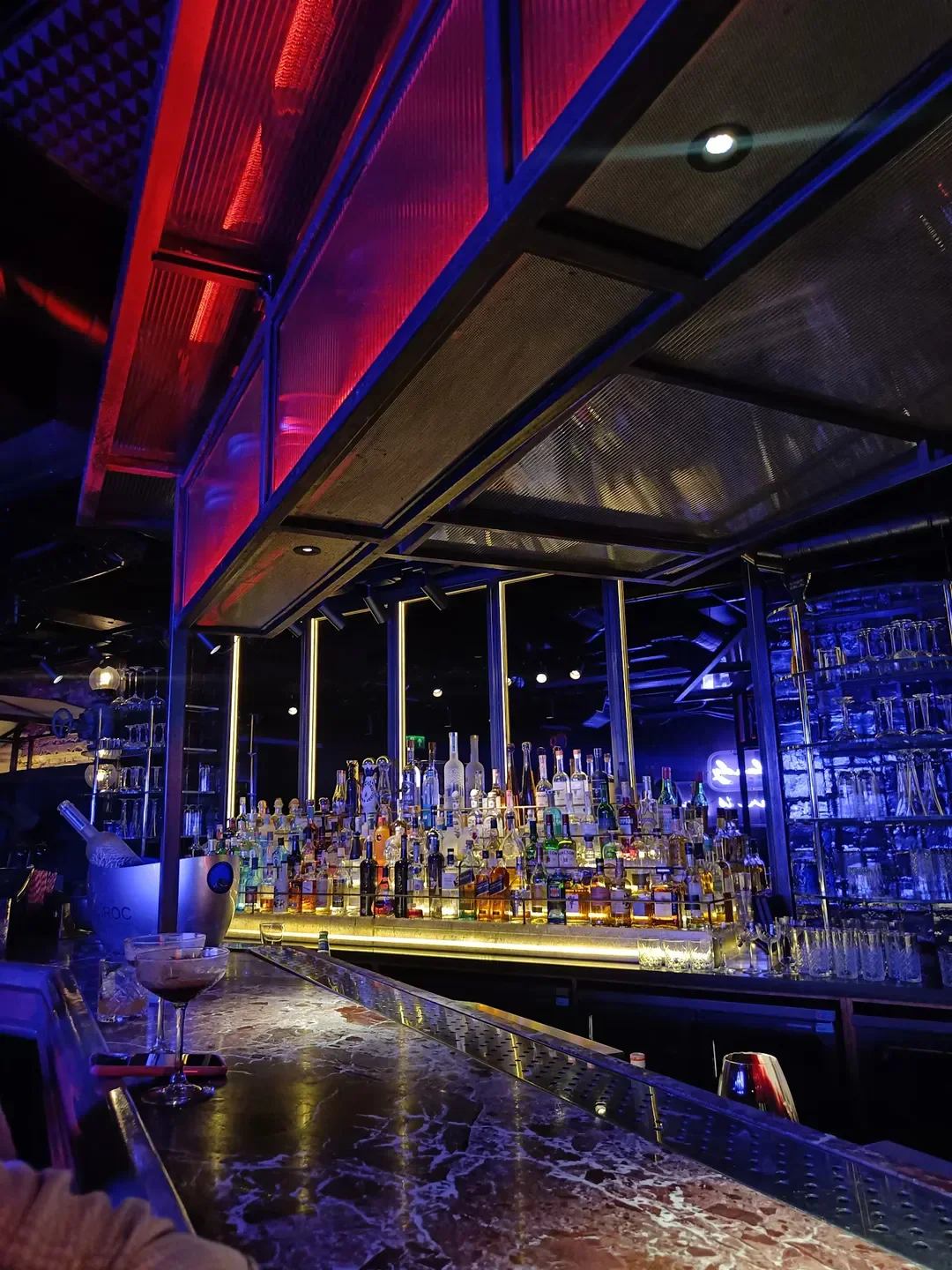 Interior of Miro Mayfair restaurant in London, showcasing a stylish bar with drinks.