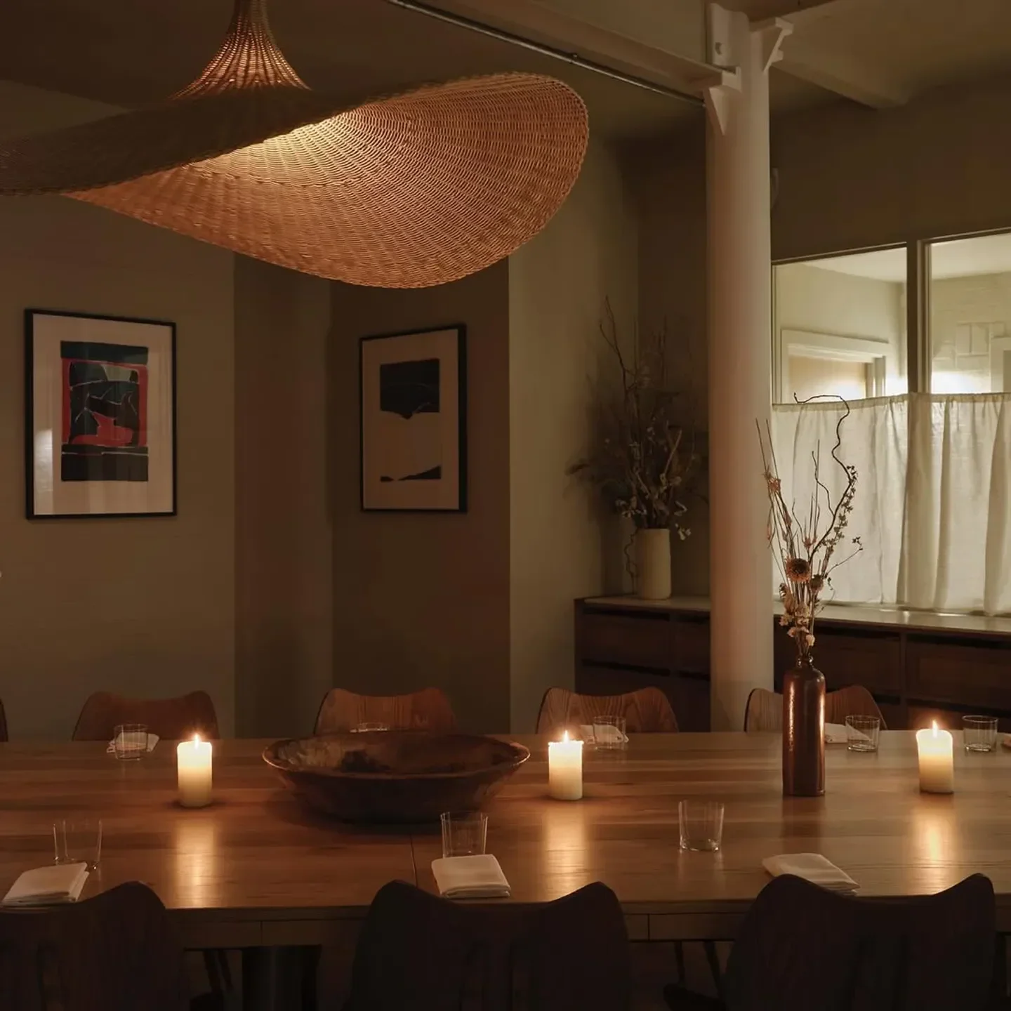 Cozy dining area at Morchella restaurant in London, with candlelit table setting.