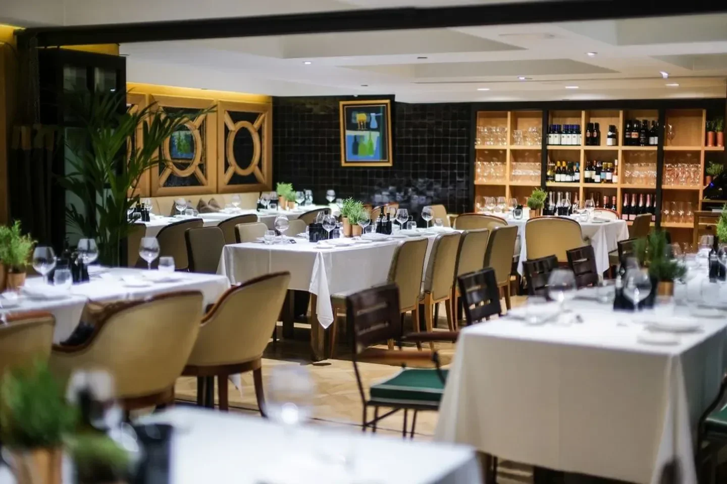 Elegant dining area at Novikov restaurant in London, with tables set for guests.