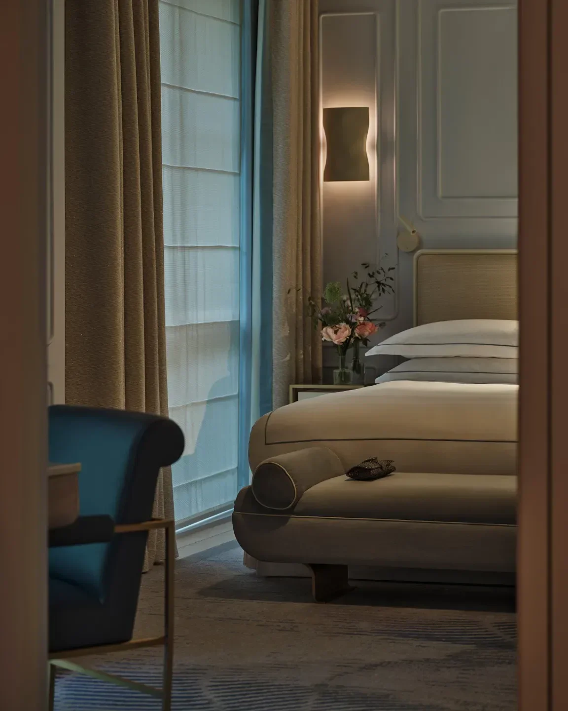 Elegant bedroom interior at One Aldwych hotel in London, featuring stylish decor.