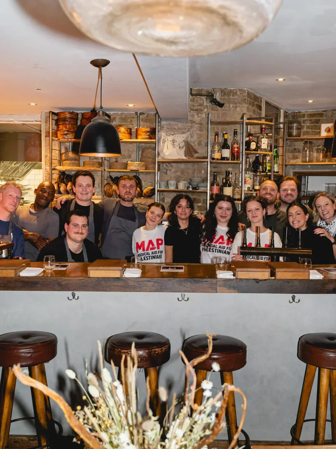 Perilla London: Group photo of staff at the stylish bar in this popular restaurant.