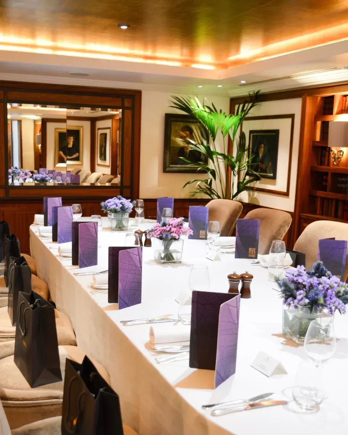 Elegant dining table set at Restaurant Francatelli in London, with floral centerpieces.