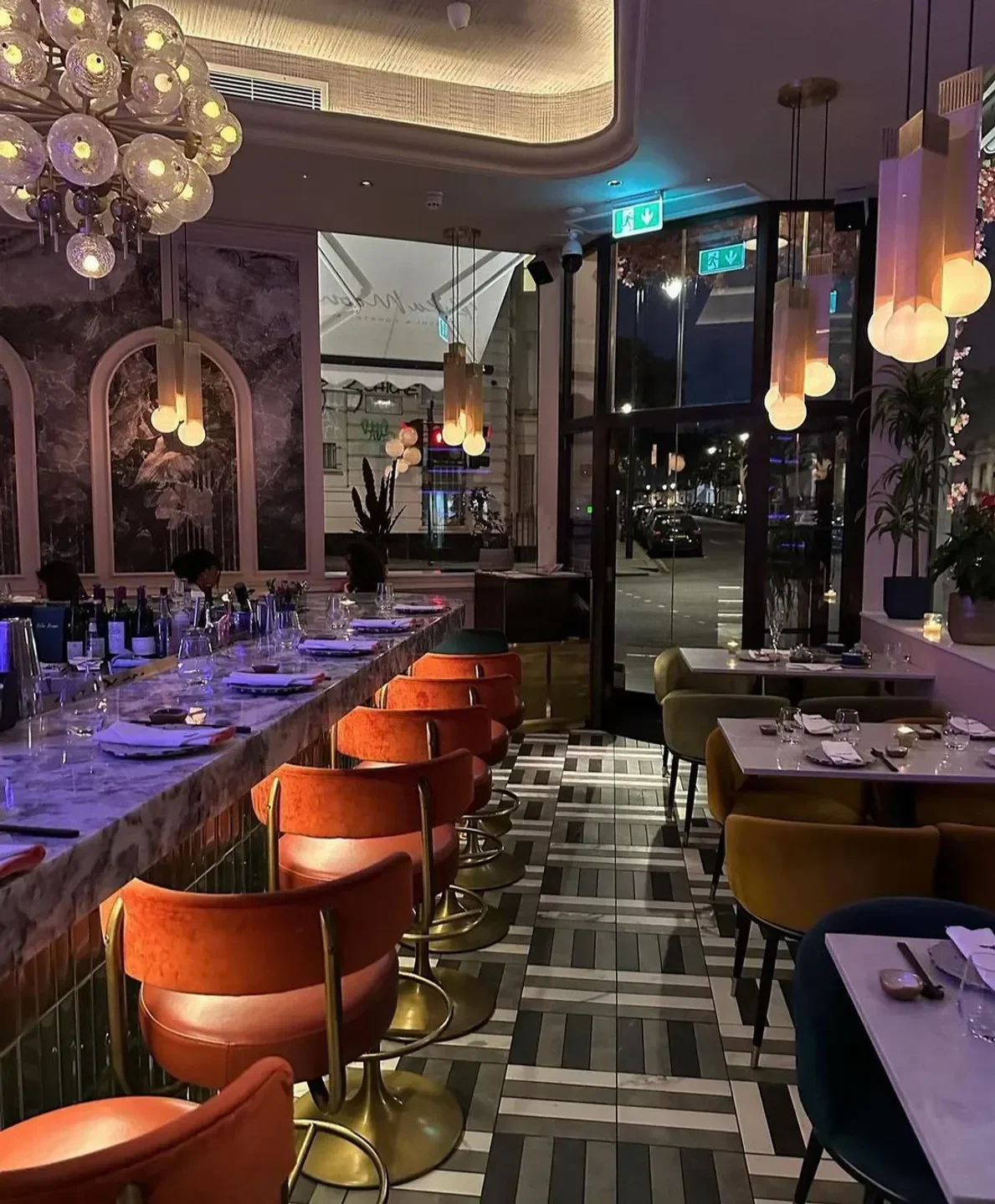 Interior view of Rika Moon restaurant in London, featuring bar seating and stylish decor.