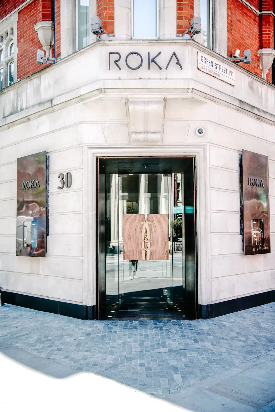 Entrance of ROKA Mayfair restaurant in London, with a modern and stylish design.
