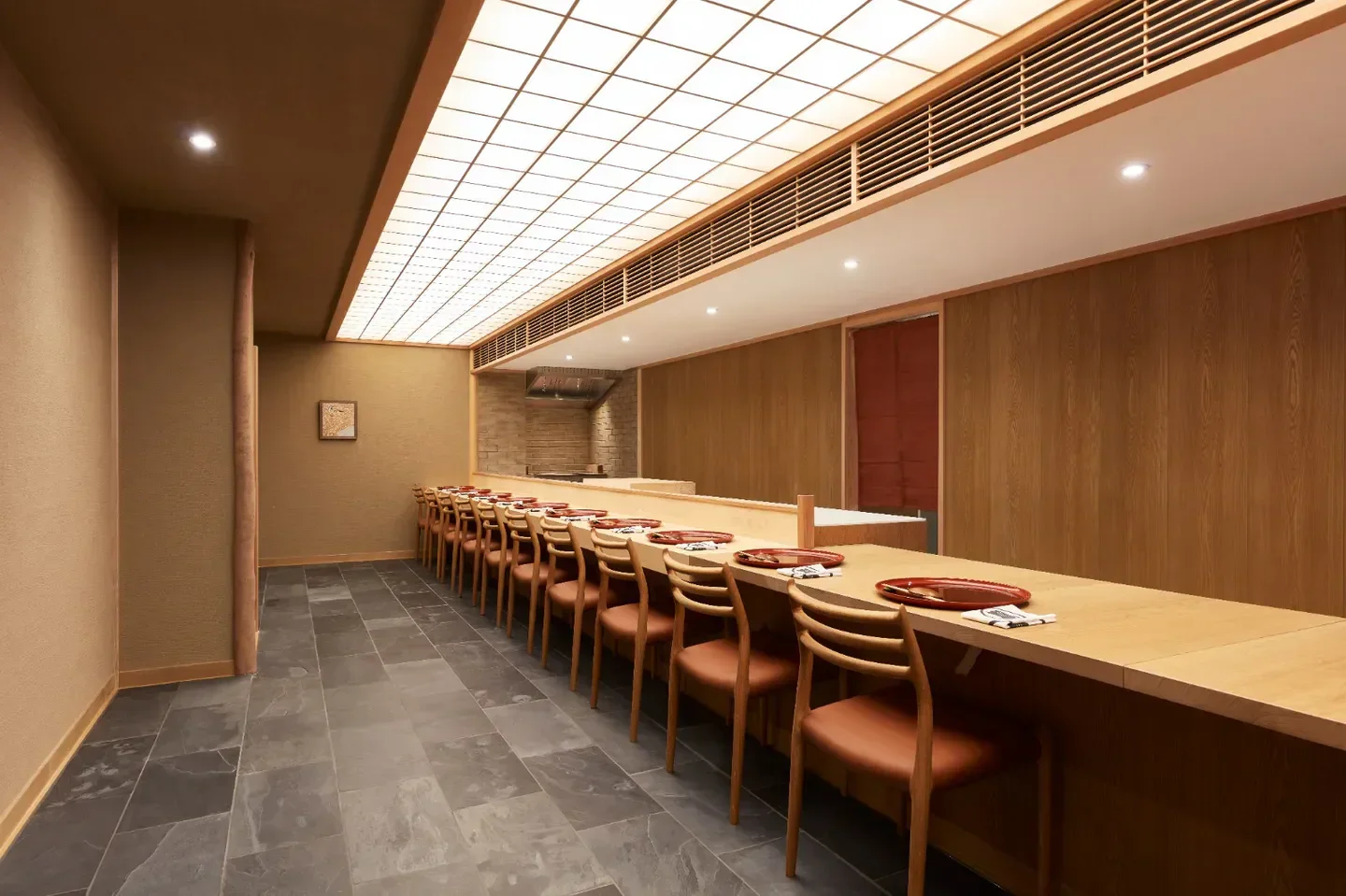 Interior dining space at ROKETSU restaurant in London, with a focus on minimalist design.