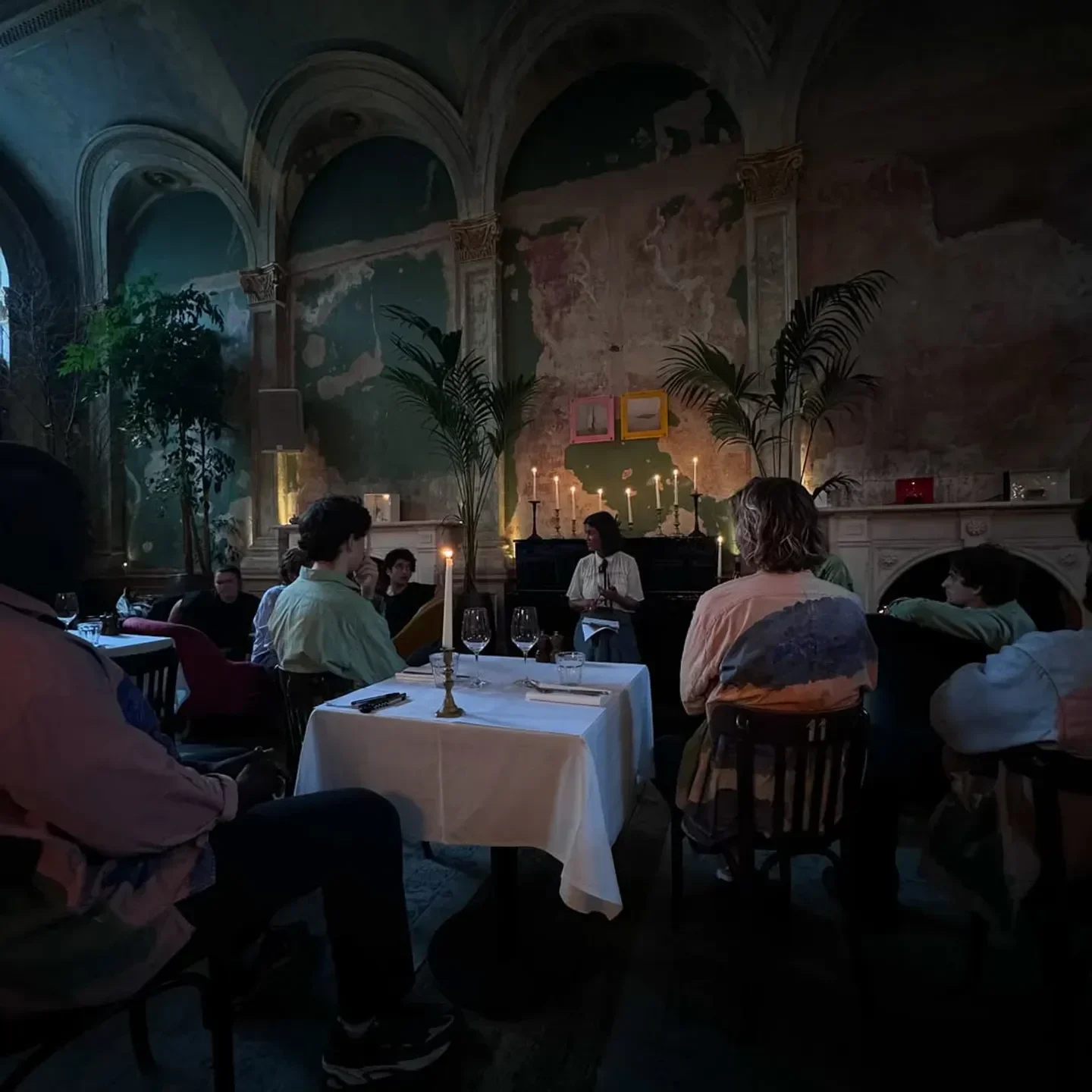 Candlelit dining at Sessions Arts Club in London, featuring a reading and elegant decor.
