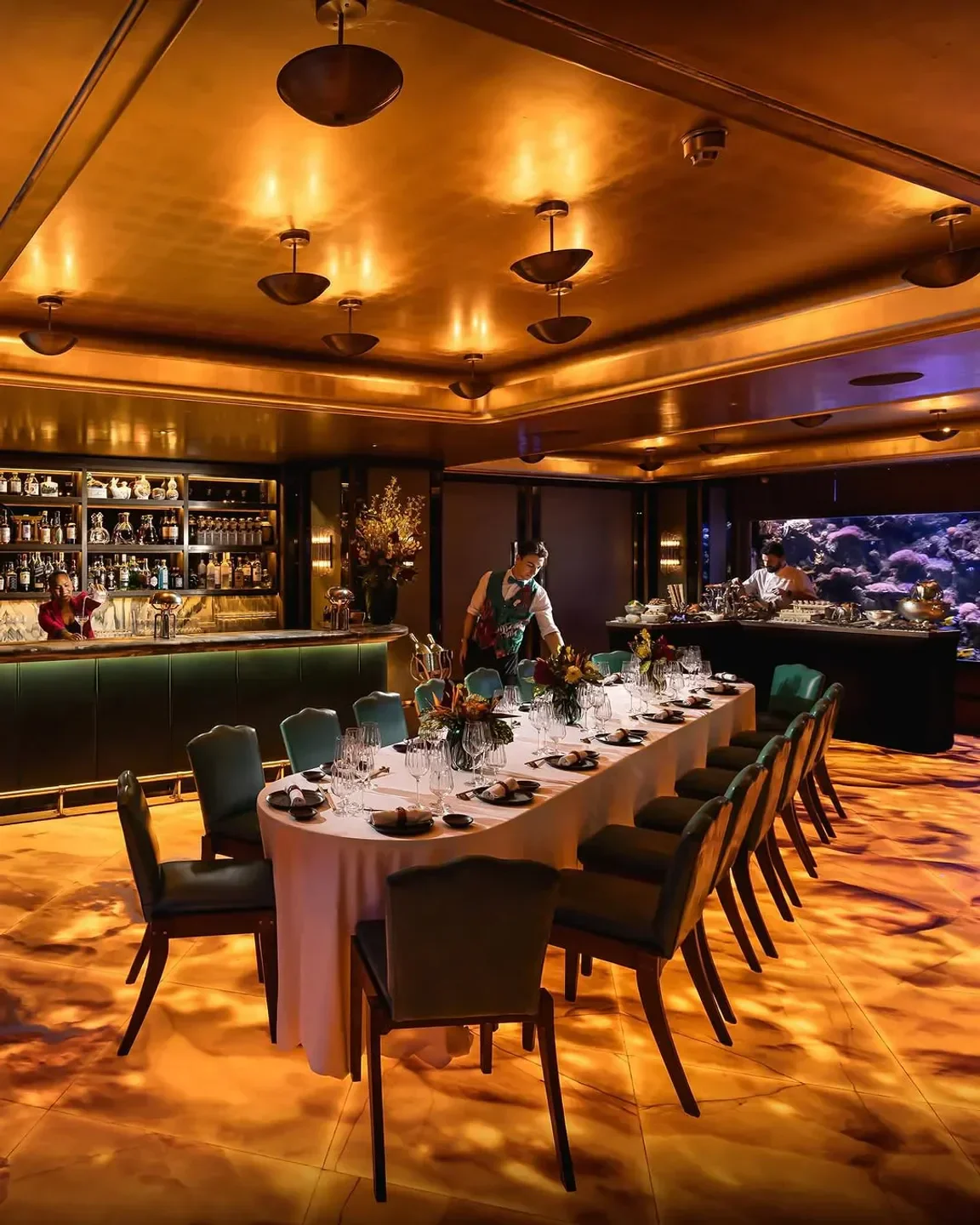 Elegant dining room at Sexy Fish London, featuring a luxurious setting and bar.