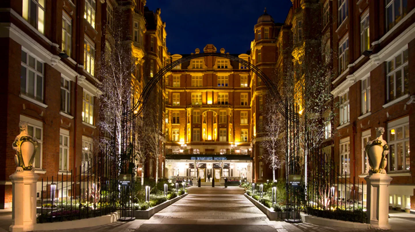 Night view of the entrance to St. Ermin's Hotel in London, lit pathway