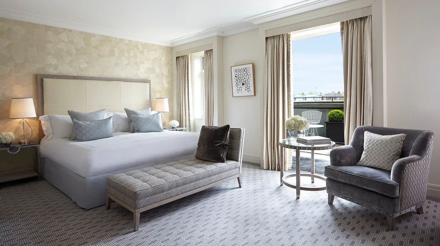 Elegant bedroom at The Berkeley hotel in London with balcony and seating area