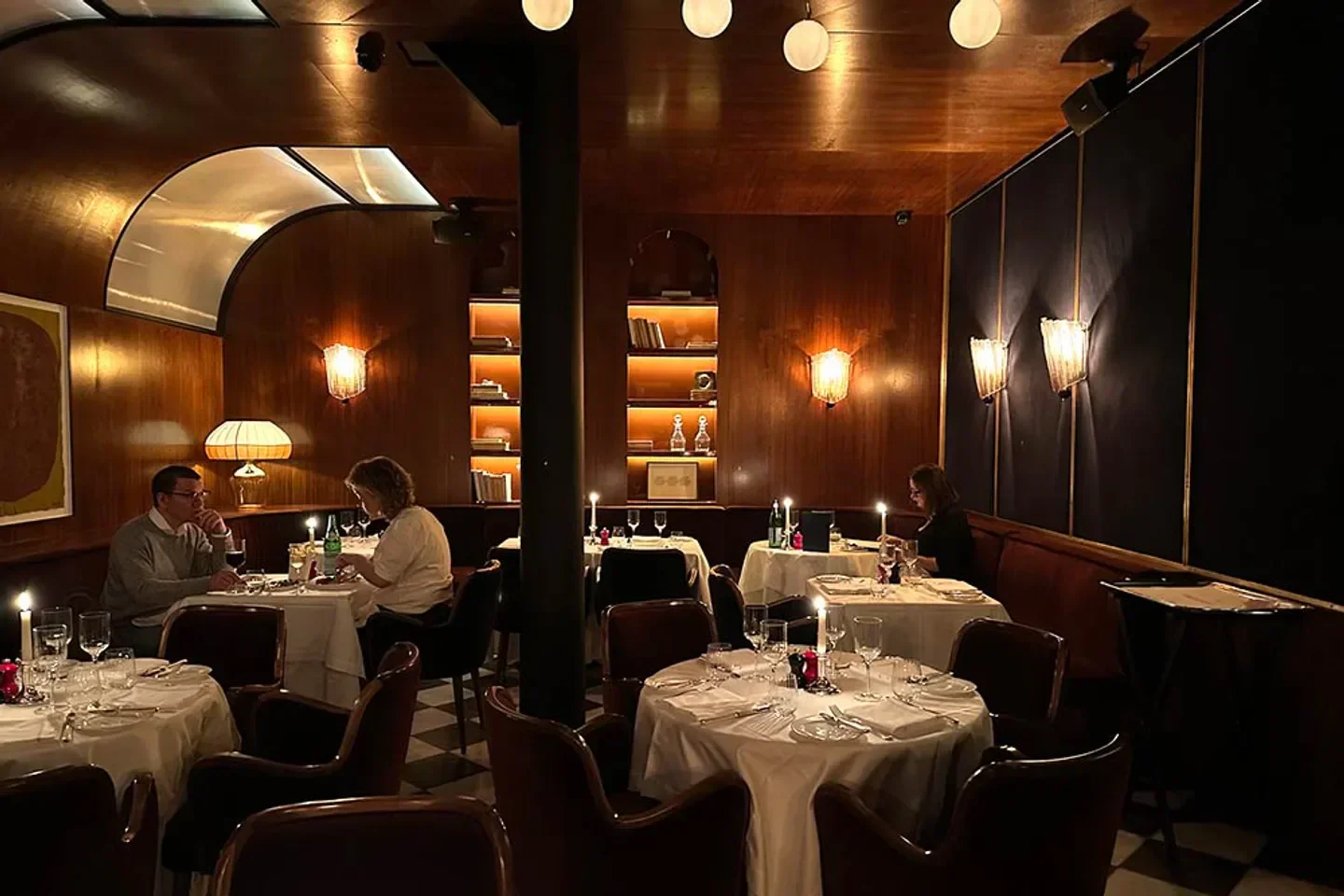 Cozy dining room at The Dover restaurant in London, with intimate tables and warm lighting