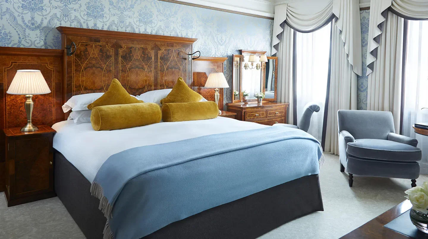 Cozy bedroom interior at The Goring hotel in London, featuring luxury decor.
