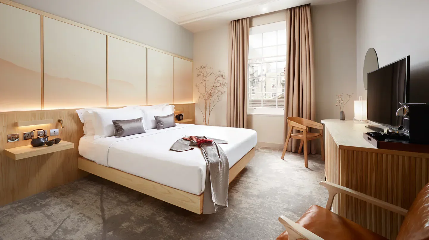 Modern bedroom interior at The Prince Akatoki London hotel in London, featuring clean design.