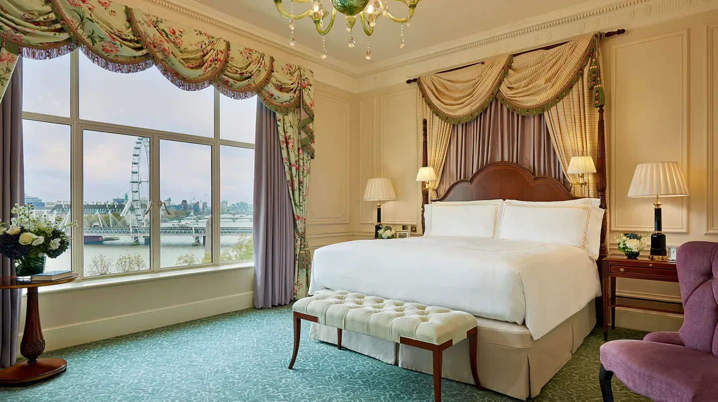 Elegant bedroom at The Savoy in London, overlooking the city and the London Eye.