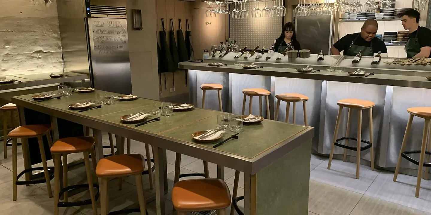 Interior of The Sea, The Sea restaurant in London, featuring the bar and dining area.