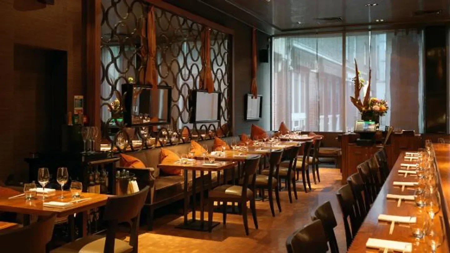 Interior of Umu London restaurant, featuring a stylish dining area with tables and chairs.